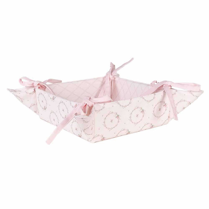 Ein Clayre & Eef - Brotkorb Hase Rosa mit Schleifen darauf.