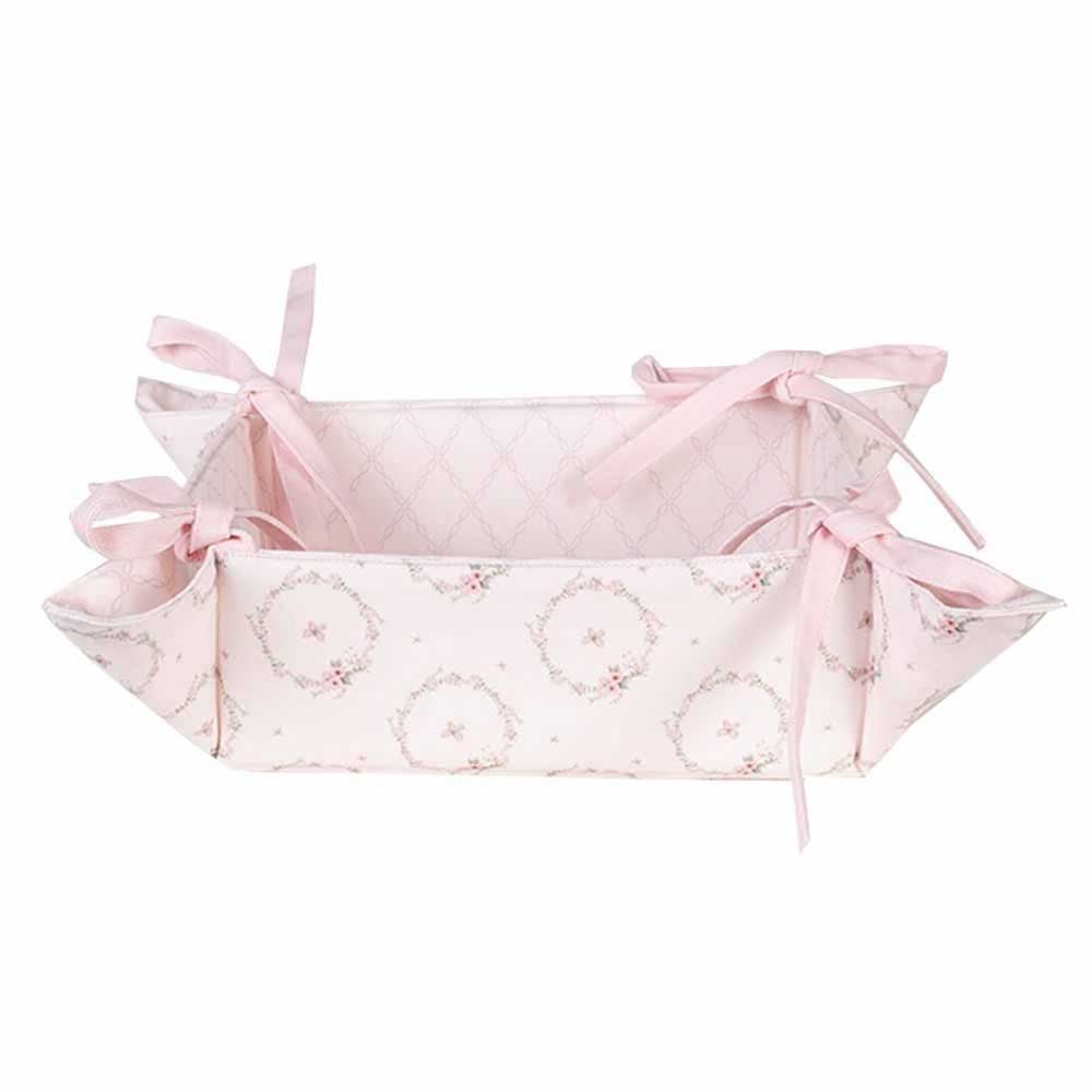 Ein Clayre & Eef - Brotkorb Hase Rosa mit Schleifen darauf.