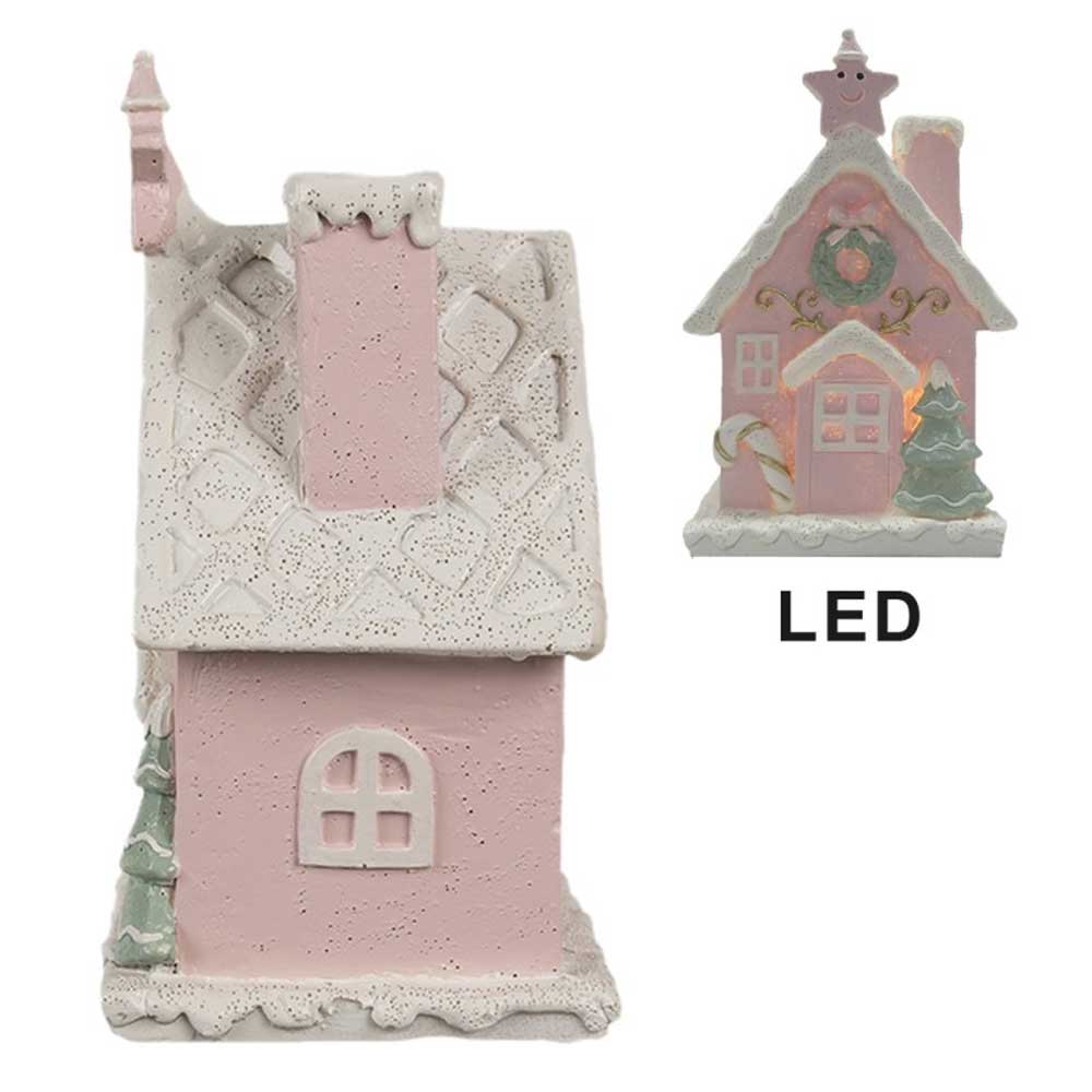 Wir präsentieren das Clayre & Eef - Lebkuchenhaus mit LED 15 cm Rosa: ein bezauberndes Keramikhaus mit rosafarbener Außenseite, weißem Dach und Schornstein. Es ist wunderschön mit festlichen Dekorationen geschmückt, darunter ein Kranz, eine Zuckerstange, ein Stern und ein kleiner Baum.