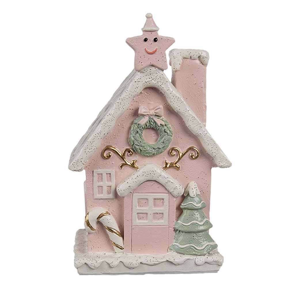 Wir präsentieren das Clayre & Eef - Lebkuchenhaus mit LED 15 cm Rosa, ein rosafarbenes Keramikhaus mit bezaubernden weißen Schneeakzenten, gekrönt von einem lächelnden Stern an der Spitze. Ein festlicher Kranz schmückt den Bereich über der Tür, ergänzt durch eine Zuckerstange am Eingang und begleitet von einem grünen Weihnachtsbaum an der Seite.