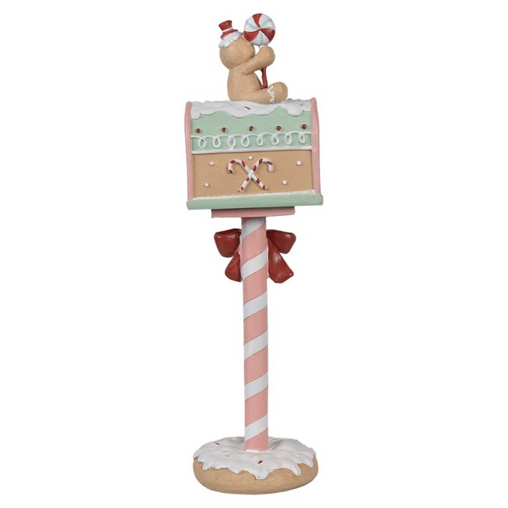 Wir präsentieren den „Weihnachtsdeko-Briefkasten Lebkuchenmann“ von Clayre & Eef, einen dekorativen Briefkasten mit einem bezaubernden Lebkuchendesign, auf dem ein Bär mit einer Zuckerstange in der Hand oben drauf sitzt, sowie einer Stange in Zuckerstangen-Optik mit Schleifen.