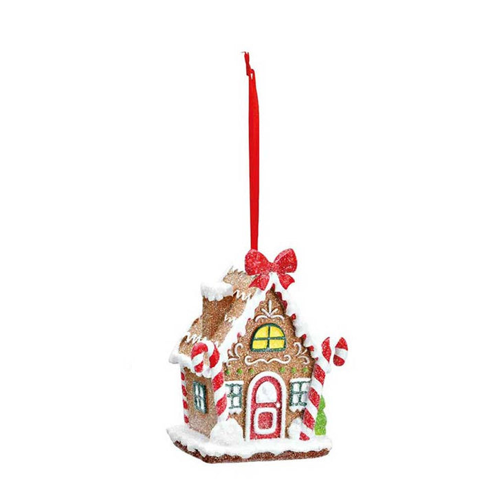 Ein G. Wurm - Anhänger Lebkuchenhaus-Ornament mit Zuckerstangen-Akzenten und einem roten Band zum Aufhängen.