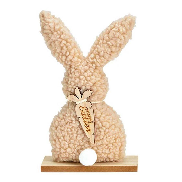 Eine G. Wurm - Aufsteller Hase Teddyfigur mit flauschiger Textur und einem Anhänger mit der Aufschrift „Ostern“.