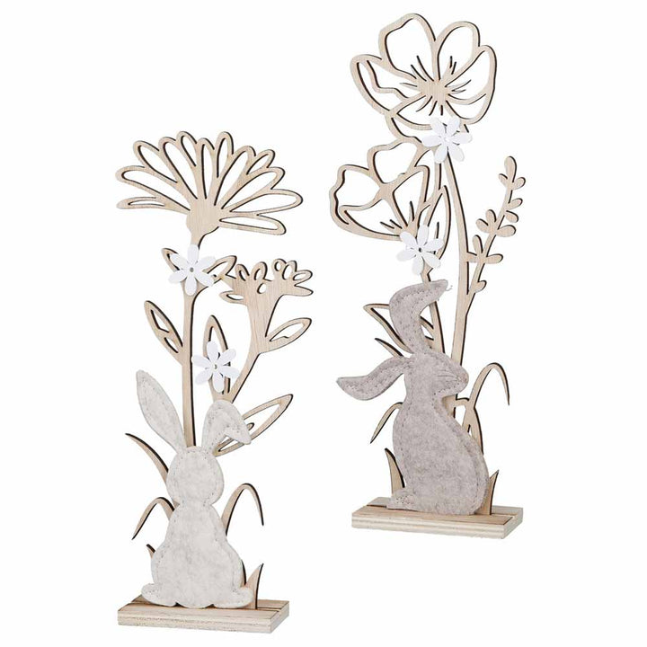 Das Gilde - Hase & Blume Deko Holz Standrelief besteht aus zwei Dekoteilen aus Holz: einmal mit einem Kaninchen und einmal mit einem Hasen, beide geschmückt mit Blumen auf Ständern.