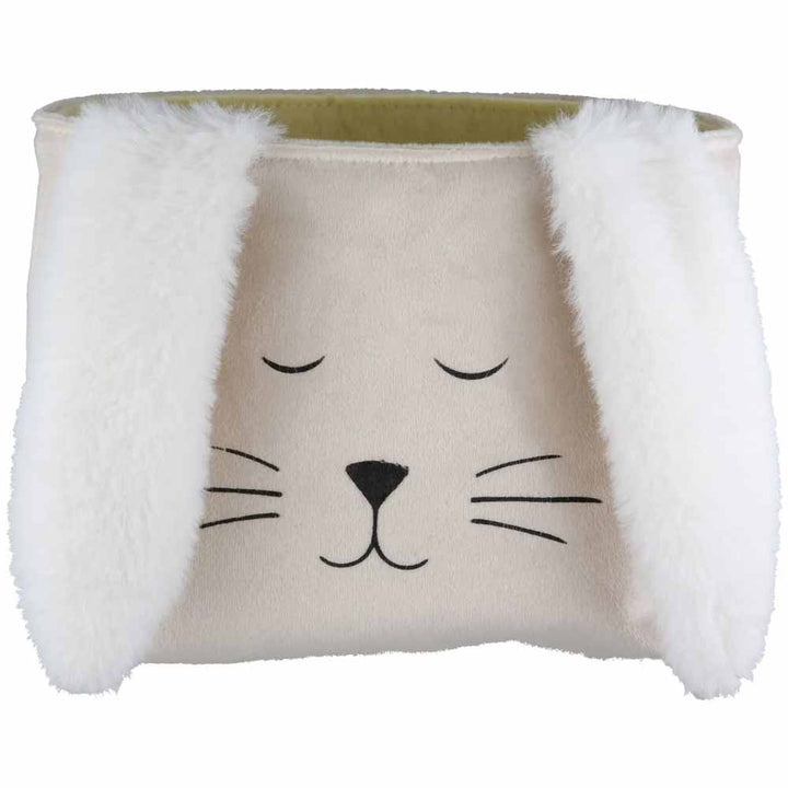 Die Gilde - Ostertasche Schlappi ist ein weißer Aufbewahrungskorb mit einem süßen Tiergesicht mit geschlossenen Augen, Schnurrhaaren und flauschigen Ohren.