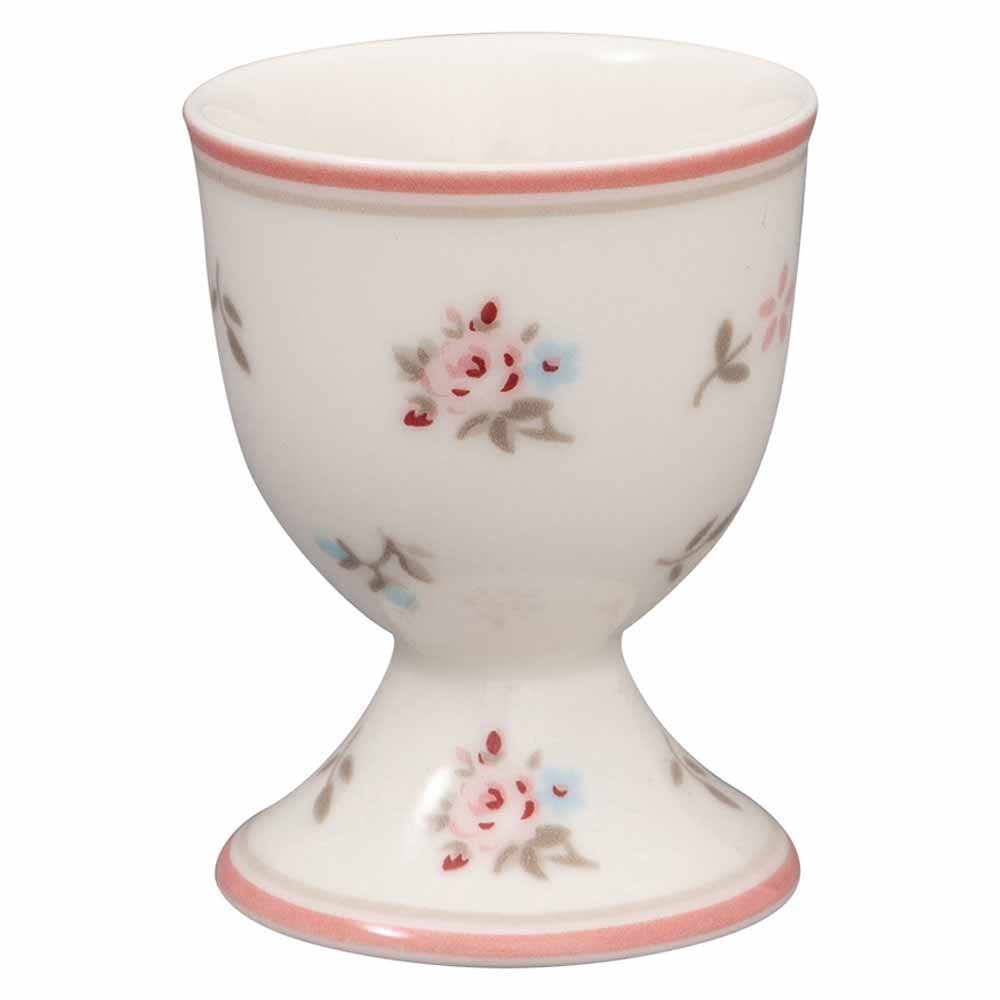 Ein weißer GreenGate - Junia Eierbecher, geschmückt mit rosa und blauen Blumenmustern und einem rosa Rand oben und unten.