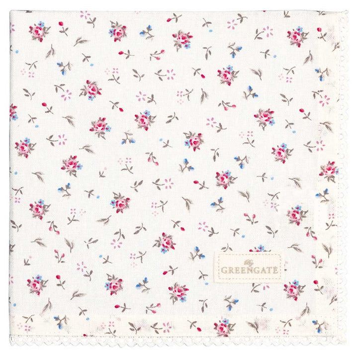 Eine weiße Stoffserviette mit kleinen blauen und rosa Blumenmustern und Spitzenbesatz am Rand, versehen mit einem „GreenGate - Junia Stoffserviette mit Spitze weiß“-Etikett.