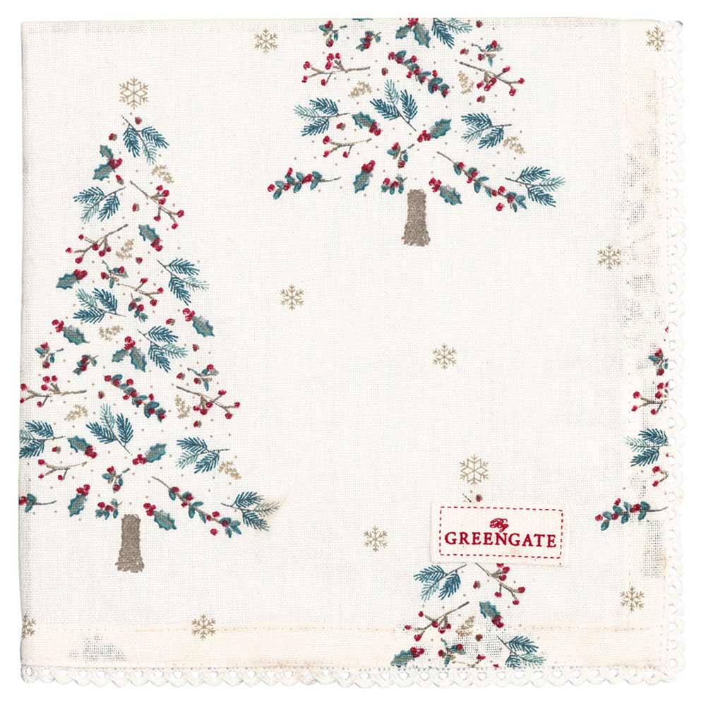 Eine GreenGate - Lucie xmas Stoffserviette mit Spitze in Weiß mit aufgestickten Weihnachtsbäumen, Schneeflocken und roten Beeren. In der unteren rechten Ecke befindet sich ein „GREENGATE“-Etikett.