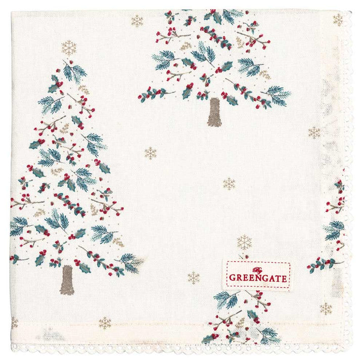 Eine GreenGate - Lucie xmas Stoffserviette mit Spitze in Weiß mit aufgestickten Weihnachtsbäumen, Schneeflocken und roten Beeren. In der unteren rechten Ecke befindet sich ein „GREENGATE“-Etikett.