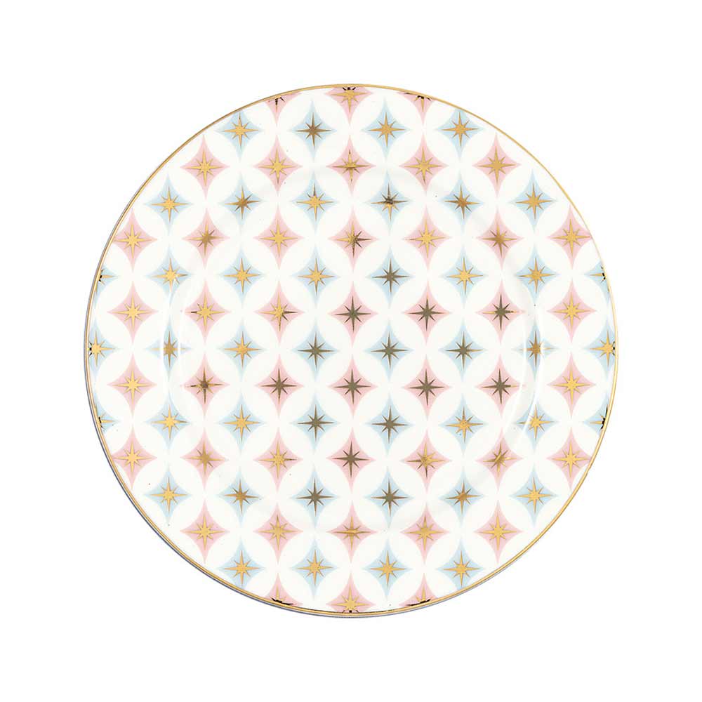 GreenGate - Novella Keksteller weiß mit einem sich wiederholenden Muster aus Sternen in Blau, Rosa und Gelb auf weißem Hintergrund, eingefasst mit einem goldenen Rand.