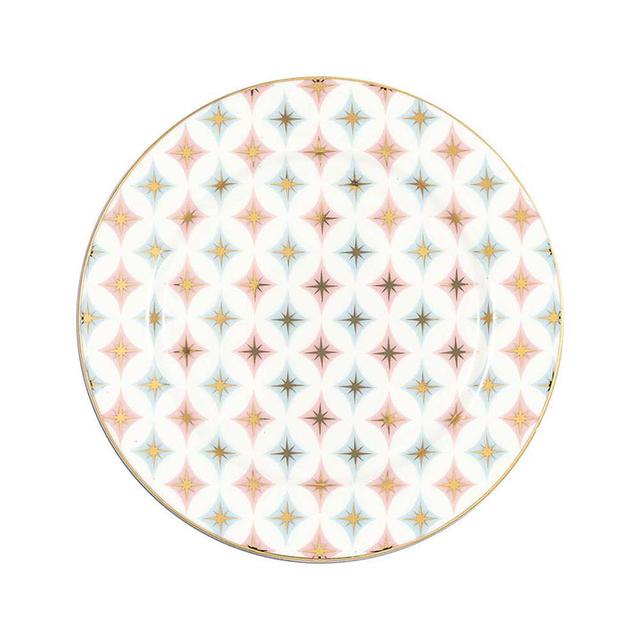 GreenGate - Novella Keksteller weiß mit einem sich wiederholenden Muster aus Sternen in Blau, Rosa und Gelb auf weißem Hintergrund, eingefasst mit einem goldenen Rand.