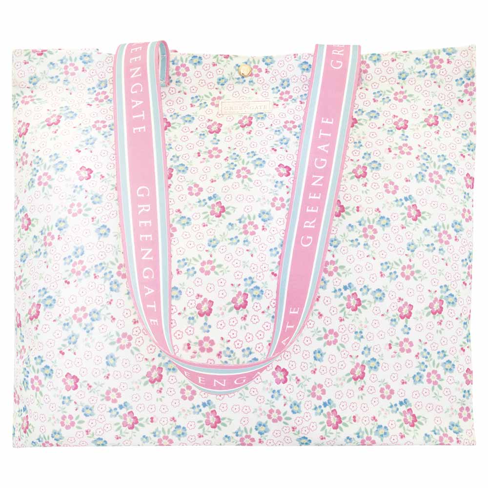 GreenGate - Shopper Allyna: Geräumige Tragetasche mit pastellfarbenem Blumendesign, rosafarbenen Henkeln und dem wiederholt aufgedruckten "GREENGATE" in Weiß.