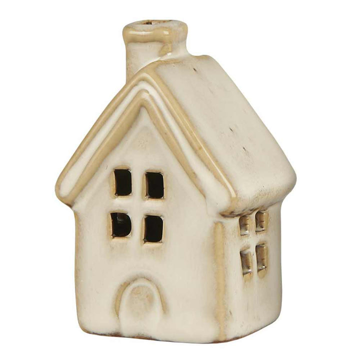 Ib Laursen Haus Mini Vintage ist eine kleine Keramik-Hausfigur in einem blassen Beigeton, komplett mit Schornstein und Fenstern.