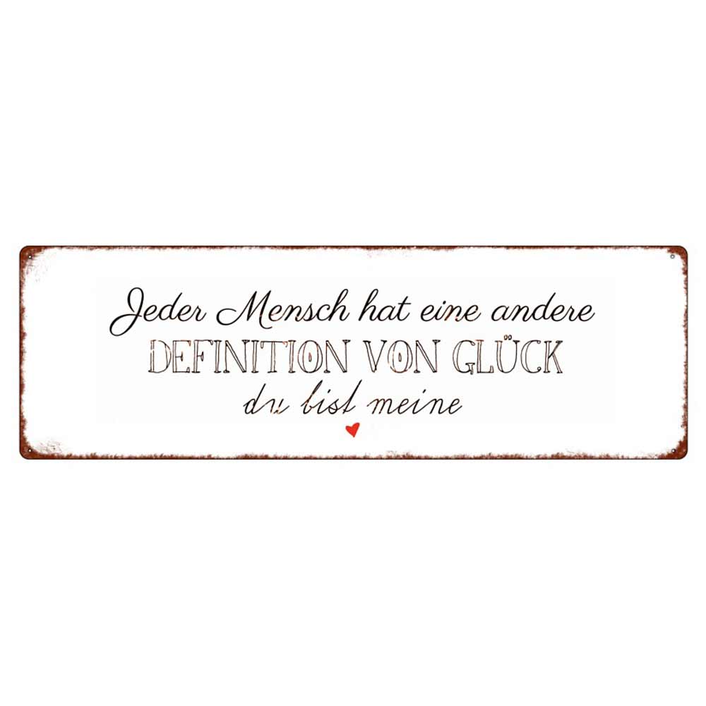 Auf einem rechteckigen Schild mit weißem Hintergrund und rostfarbenem Rand steht der deutsche Text: „Jeder Mensch hat eine andere Definition von Glück, du bist meine“ mit einem kleinen roten Herz am unteren Rand. Der Produktname lautet Interluxe Metallschild – Jeder Mensch hat eine andere Definition von Glück.