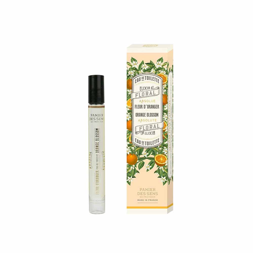 Ein Panier des Sens – Eau de Toilette Roll-on Orangenblüte 10 ml in einer schlanken, transparenten Sprühflasche neben der dekorativen Verpackung mit Blumen- und Orangenmotiv.