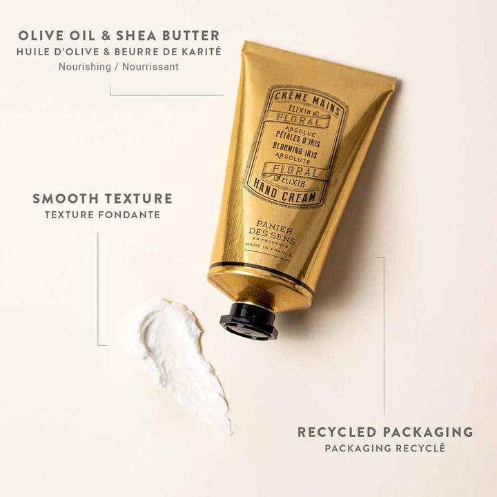 Eine Tube Panier des Sens – Handcreme Irisblüttenblätter Handcreme mit einem Klecks des verschütteten Produkts daneben, was die glatte Textur und die recycelte Verpackung hervorhebt.