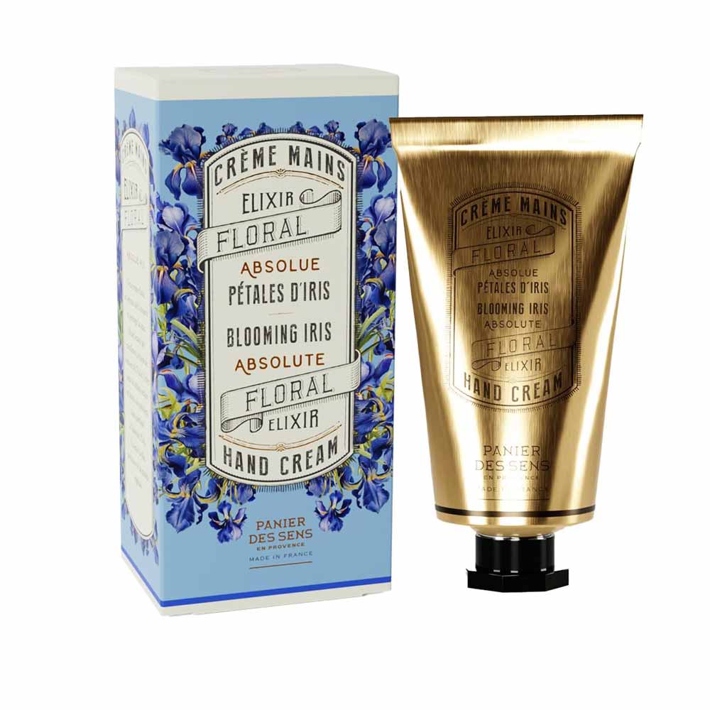 Panier des Sens - Handcreme Irisblüttenblätter mit floralem Verpackungsdesign neben der Schachtel.