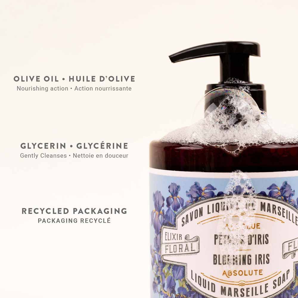 Eine Flasche Panier des Sens – Marseiller Flüssige Handseife Irisblütenblätter 500 ml, mit Blasen darauf. Das Etikett hebt das pflegende Olivenöl, das sanfte Glycerin und die recycelte Verpackung hervor.