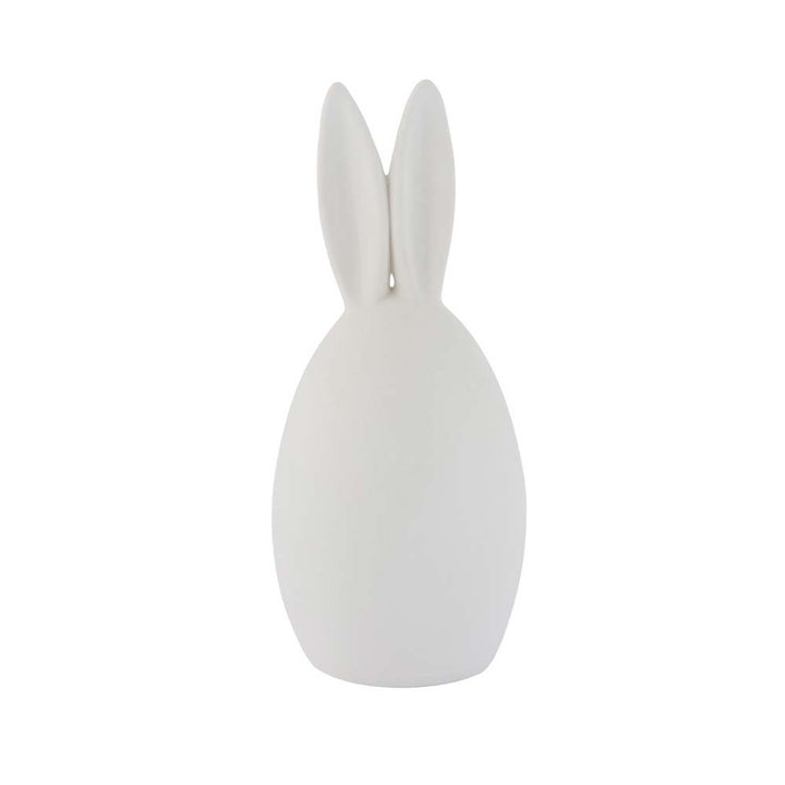 Der Storefactory Hase Emma ist ein weißes, eiförmiges Objekt mit Hasenohren auf der Oberseite vor einem schlichten Hintergrund.