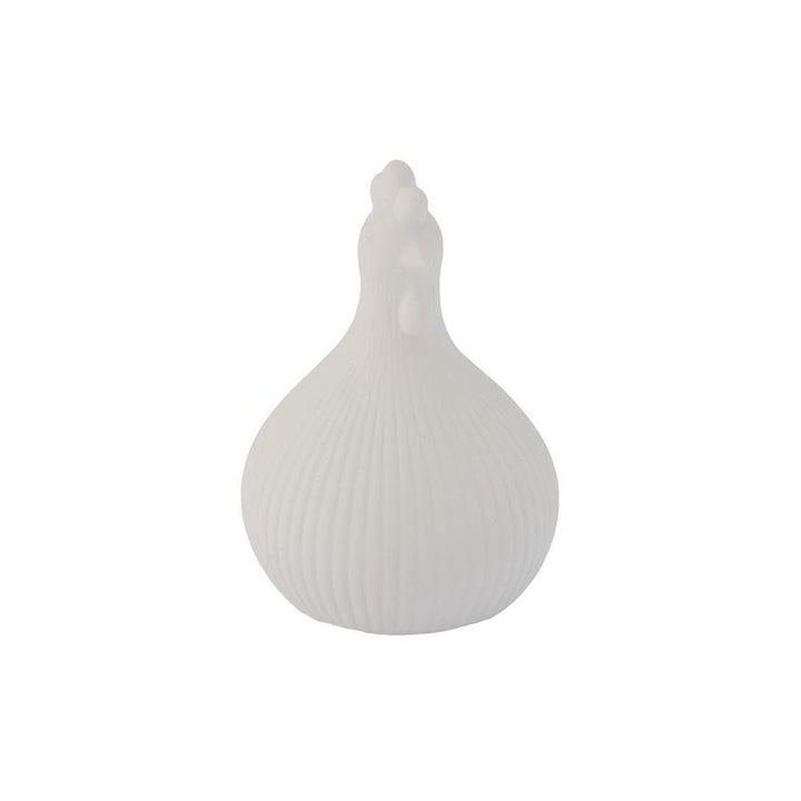 Das Storefactory Huhn Kerstin ist ein weißes, rundes, geripptes Objekt mit einer spitzen Spitze, die an einen Hahnenkopf erinnert, vor einem weißen Hintergrund.