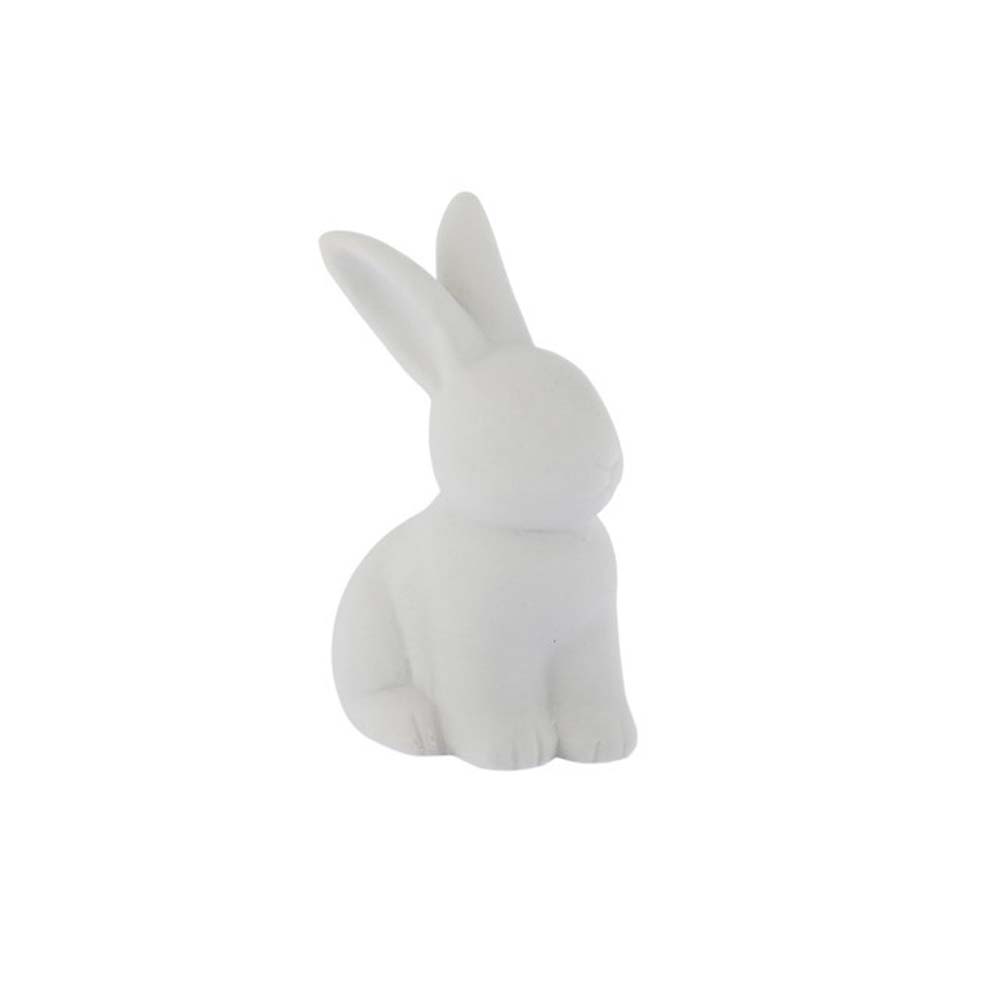 Der Oskar Hase von Storefactory ist eine kleine, glatte, weiße Hasenfigur aus Keramik, die aufrecht sitzt und die Ohren nach oben richtet.