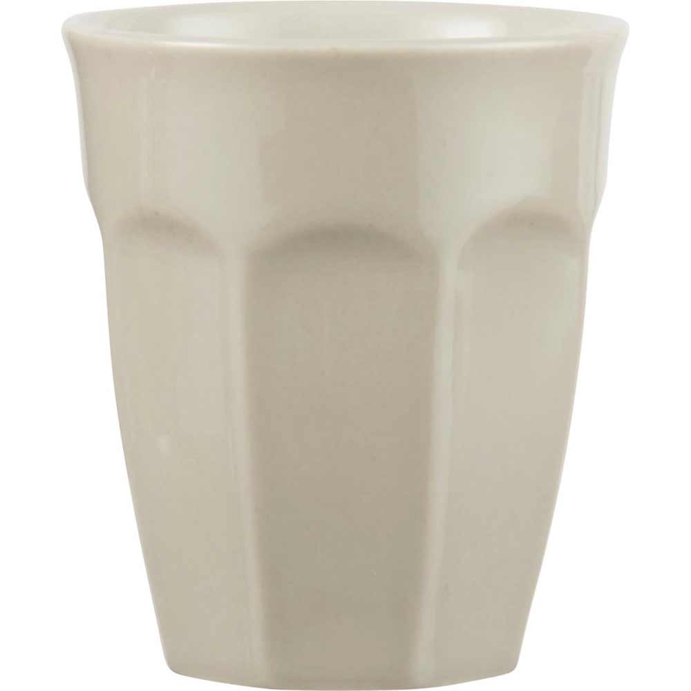 Ein schlichter beiger Ib Laursen - Cafe Latte Becher Mynte mit leicht konischem Design und glatter Oberfläche.